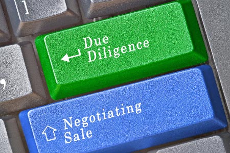 Due Diligence & Negotiating Sale keys on keyboard